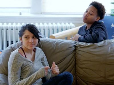 Brianna Jaramillo and Danea Hudson are sitting on the couch from completely different angles.